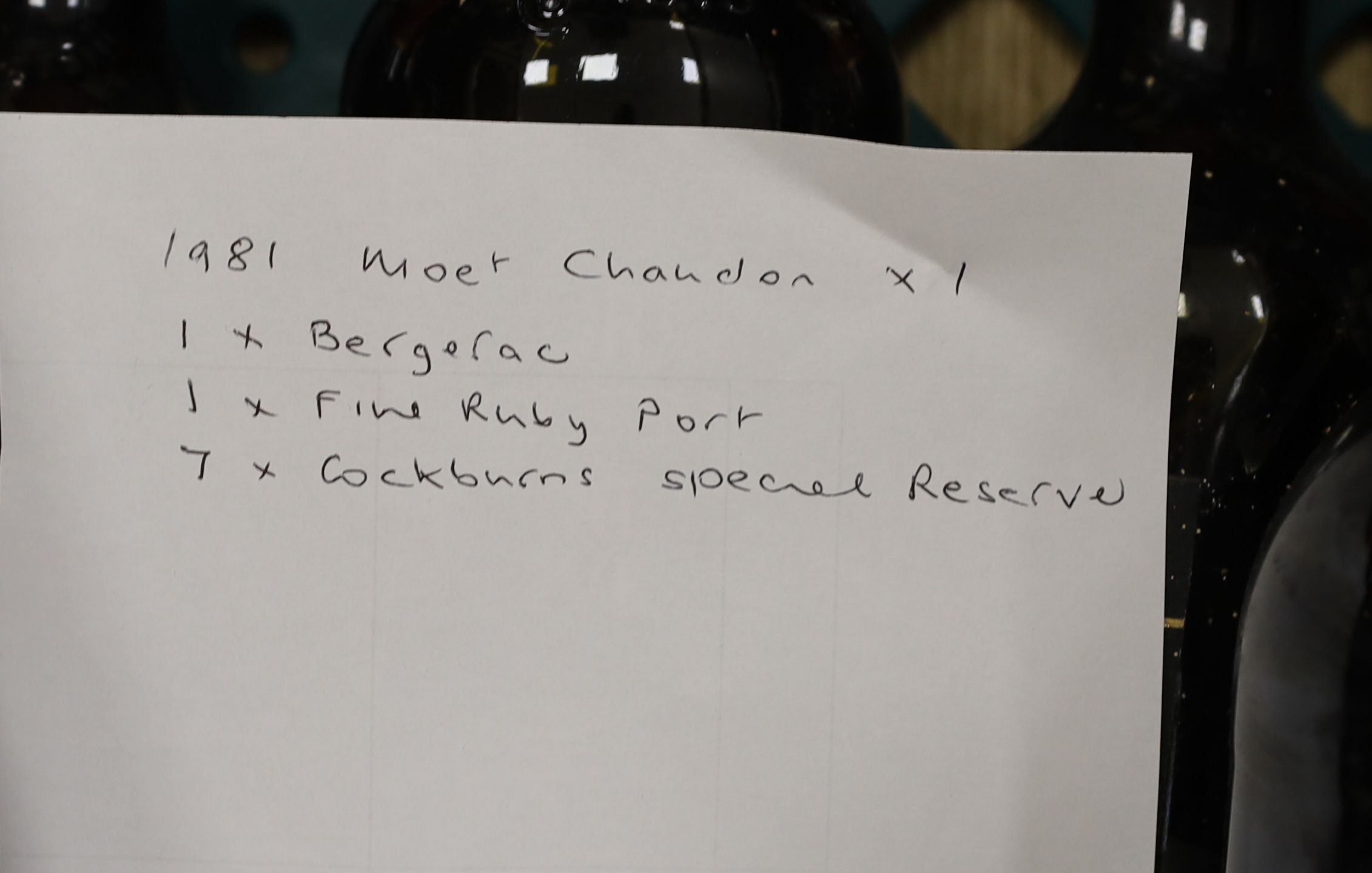 10 bottles: Moet & Chandon, Bergerac, fine ruby port and 7 Cockburns port